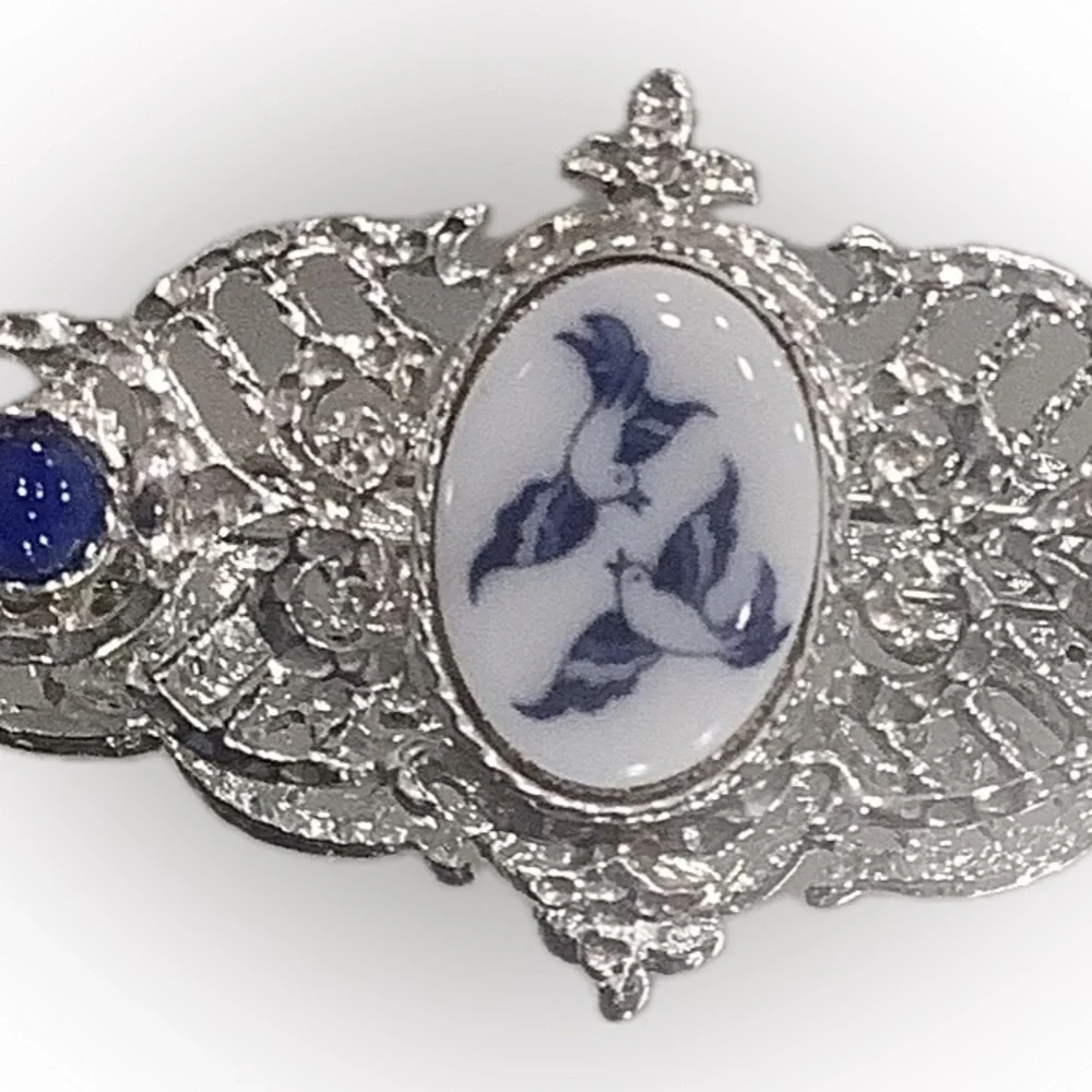 Silver-Tone Filigree Brooch with Blue/White Bird Design